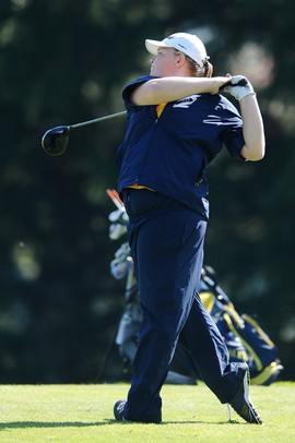 Saline's Emily White watches her ball after teeing off during golf regionals at the University of Michigan Golf Course on Thursday. Melanie Maxwell I AnnArbro.com